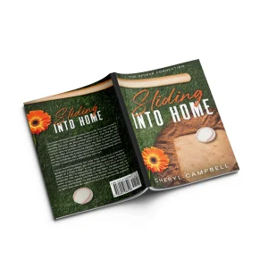 Open paperback mockup of Sliding into Home by Cheryl Campbell, a baseball sports romance novel from The Decker Connection series featuring a baseball field, ball, and flowers on the cover.