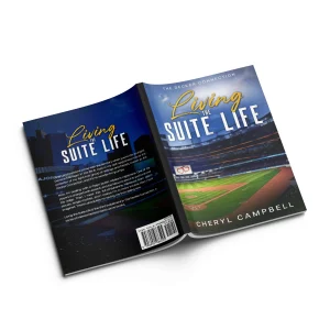 Open paperback mockup of Living the Suite Life by Cheryl Campbell, a baseball sports romance novel featuring a stadium cover from The Decker Connection series.